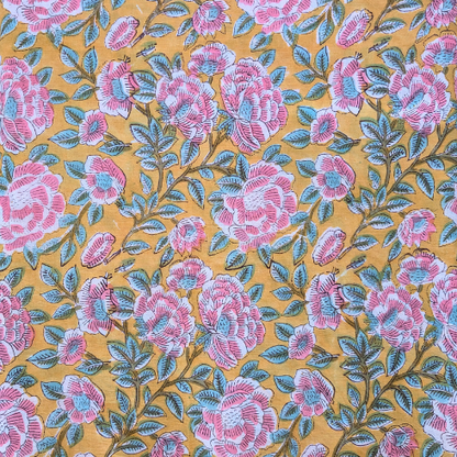 Floral pattern with pink flowers and green leaves on a yellow background